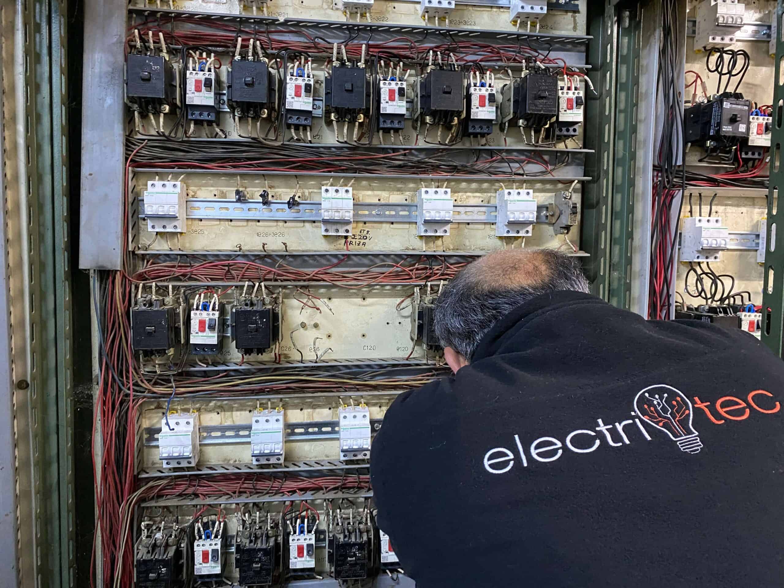 electrician working on control panel